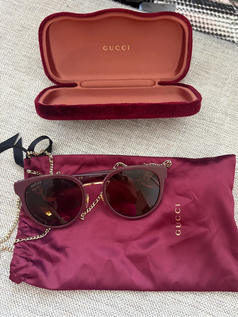 Gucci Women's Wine Red Cat Eye Sunglasses with Gold Chain